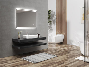 Badezimmer Design mit beleuchtetem Wandspiegel, schwarzem Waschtisch und Wand-WC.